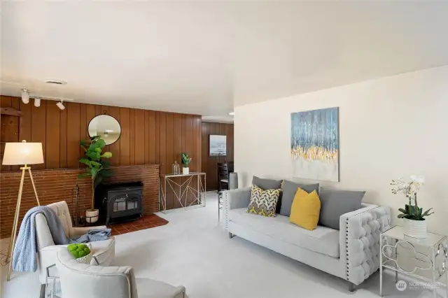 Enter into a spacious, welcoming living room with freshly painted walls and brand new carpeting that includes an upgraded pad underneath.  Wood-burning stove insert keeps this part of the home toasty warm.