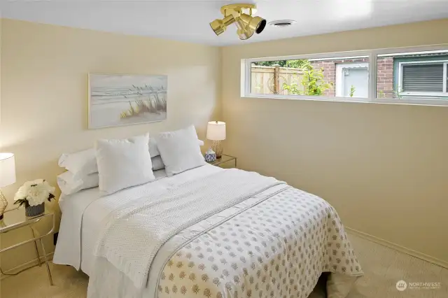 The bedroom at the back of the home also has been freshly painted and has the gorgeous new soft carpeting.  The higher windows in the bedrooms ensure privacy while at the same time allowing plenty of natural light.