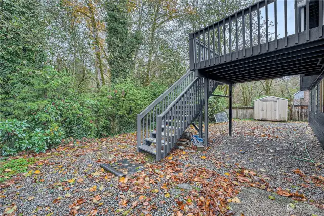 Rear yard  is level and partially fenced.  Includes the storage building.