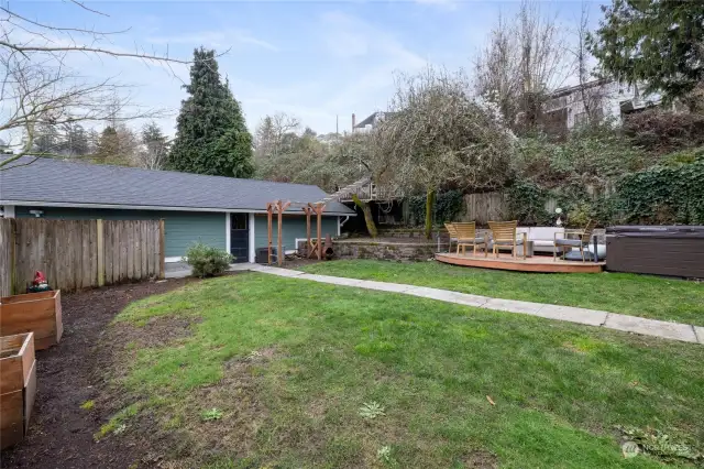 Delightful backyard leads to the HUGE detached garage that you shouldn't pass peeking your head into!