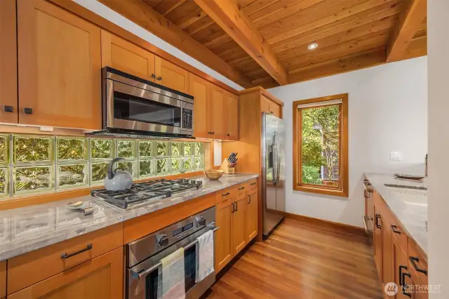 Real Quartzite stone (not human made Quartz) and high end S/S appliances.