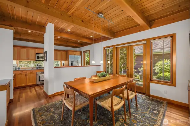 Dining room with French doors to the front yard gardens.