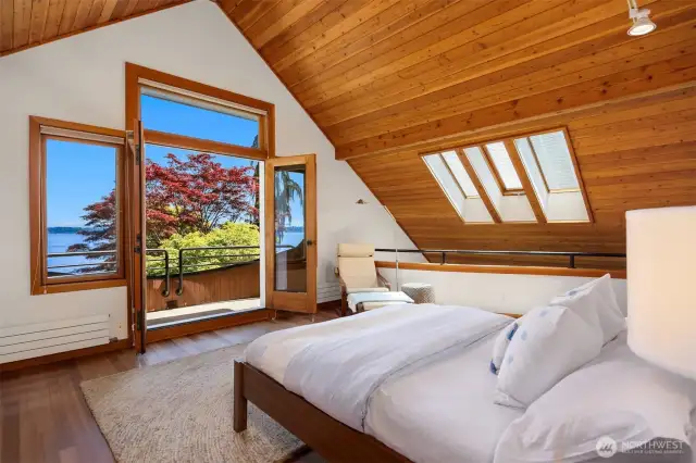 BOOM! Upper level 2nd bedroom with vaulted ceilings, full bath, and balcony!
