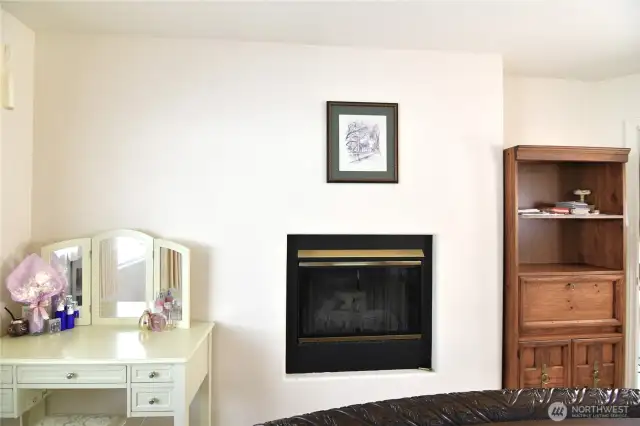 fireplace inside primary bedroom