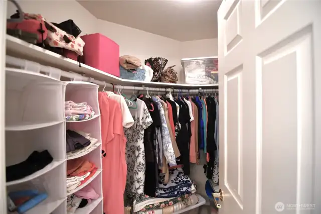 walk in closet in primary beedroom