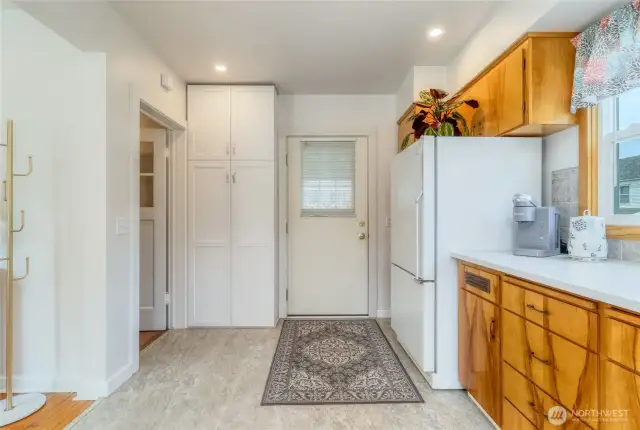 Door leads to covered deck outside. To the left is the basement