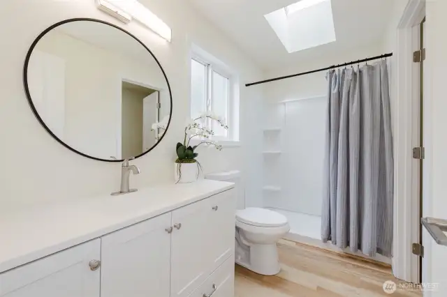 Primary bathroom, with walk in closet.
