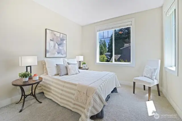 Bedroom #1 is a bright and inviting space, positioned just off the landing. With two large windows, it welcomes an abundance of natural light, creating an airy and uplifting atmosphere. The closet, thoughtfully designed with a closet organizer, maximizes storage efficiency, ensuring a well-organized and clutter-free space