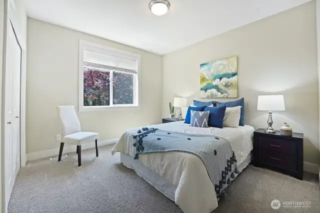 Bedroom #2 is a bright facing the garden allowing natural light to enter through the window.  The high ceilings enhance the airy, open and private feeling.  The closet is also equipped with a closet organizer, maximizing storage