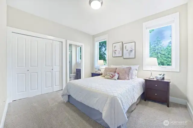 Bedroom #3 features its own ensuite 3/4 bathroom for added convenience and privacy.  The two east-facing windows welcome soft morning light and the spacious closet, maximizes storage efficiency