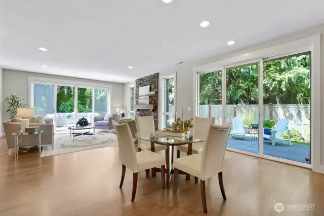 This charming breakfast nook (which can handle a much bigger table) is perfectly positioned between the family room and kitchen, creating a seamless flow for everyday living. The large slider opens directly to the outside patio, inviting fresh air and natural light into the space while being surrounded by lovely views of nature