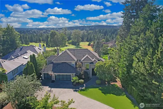 This lovely home sits above the course on the 9th T - safe from stay golf balls