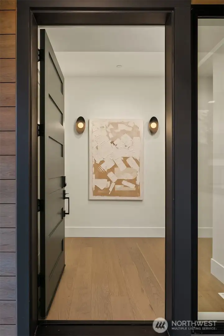 Step through a dramatic 10-foot front door that sets the tone for the luxury that unfolds inside.
