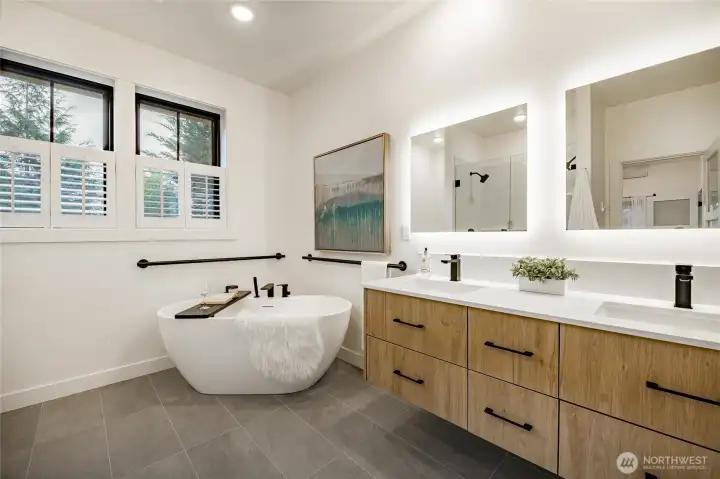 Relax in the spacious soaking tub with grab bars. Did you know that all the windows throughout the home open. A feature the other homes in the community don't get to enjoy.