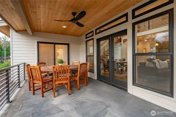 Outdoor patio with ceiling fan and dimmable lighting.