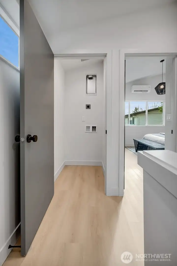 Washer and dryer hook-ups are located at the top of the stairs on the second level.