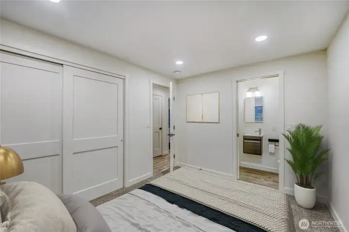 Primary bedroom, featuring a 3/4 ensuite bathroom, providing a comfortable and functional space within the home.