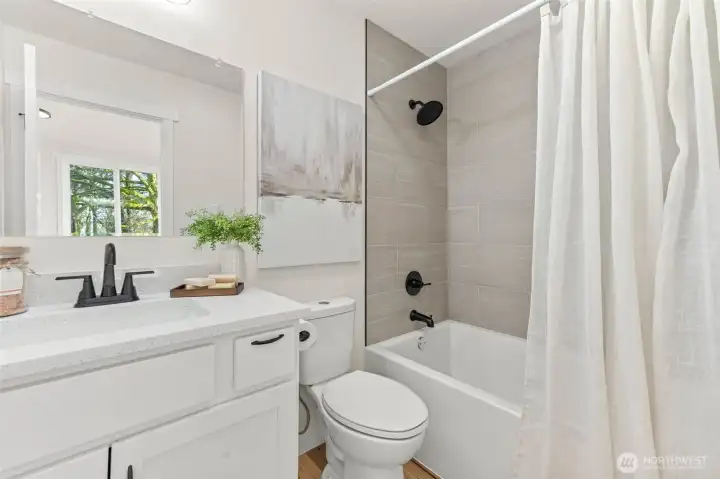 Full bathroom adjacent to primary bedroom