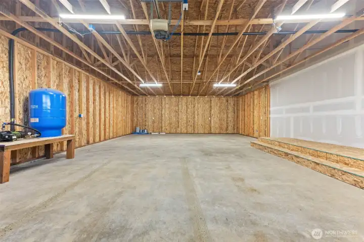 Oversized garage could fit 4 cars or 2 with a large workshop area