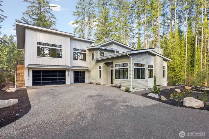 Main house, 3 car garage and a separate suite up the outdoors stairs for guests or the ultimate home office/business