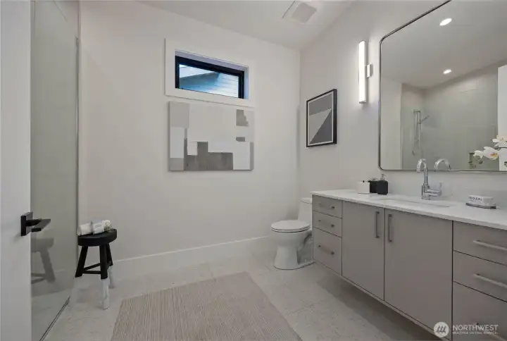 Upstairs hall 3/4 bath with heated tile floors