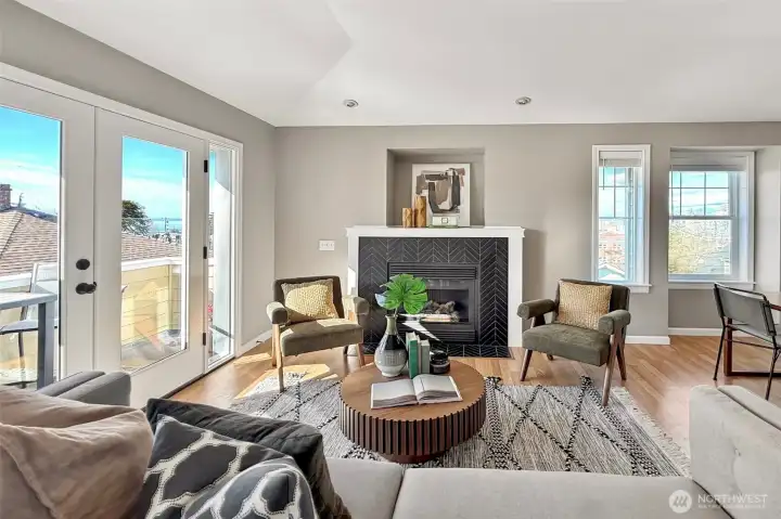 Light-filled living room with cozy gas fireplace and large windows