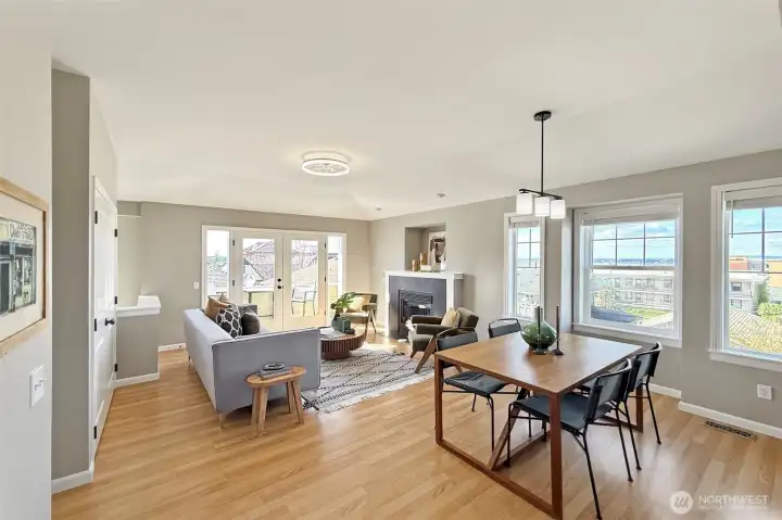 Open-concept living and dining area with abundant natural light