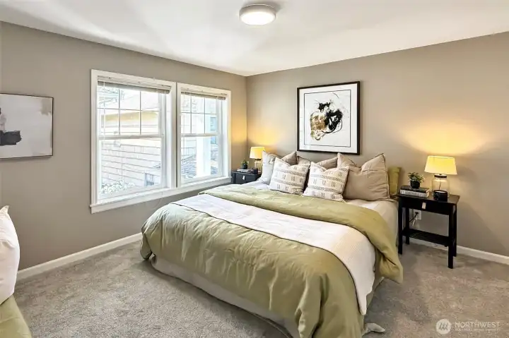 Spacious primary bedroom with natural light