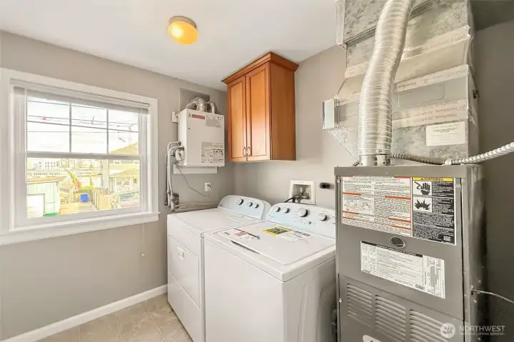 Laundry area with new washer and dryer