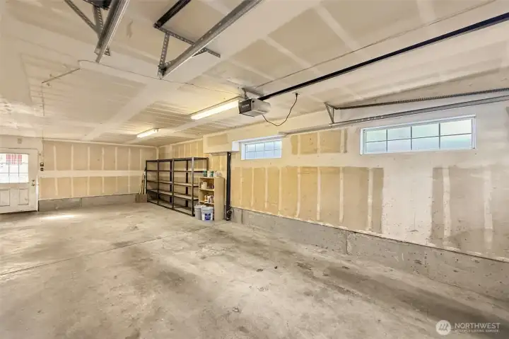 Spacious garage with room for 2 cars + storage or workspace