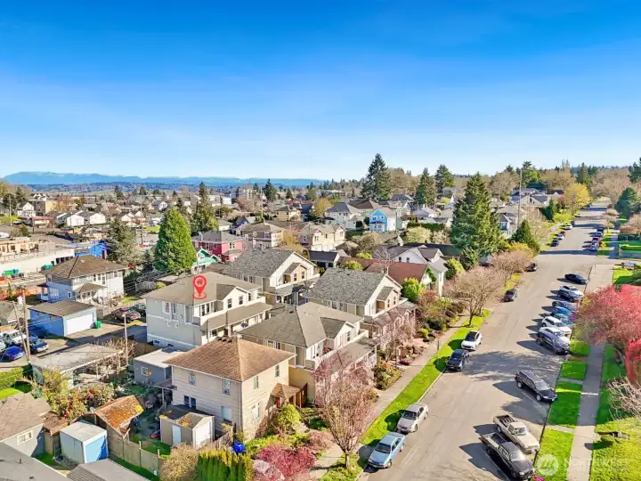 Aerial view highlighting surrounding homes and location