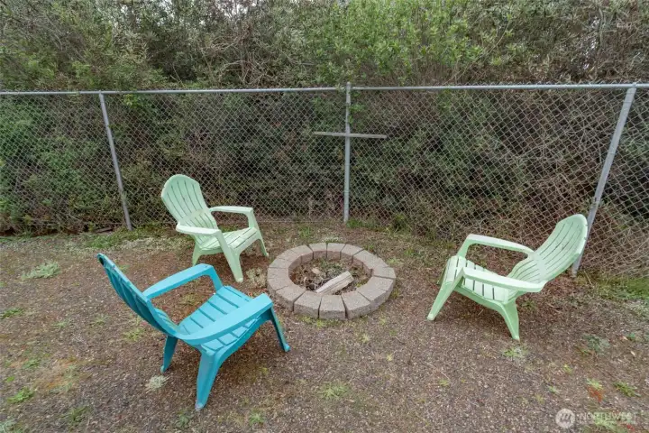 The cozy fire pit in the backyard