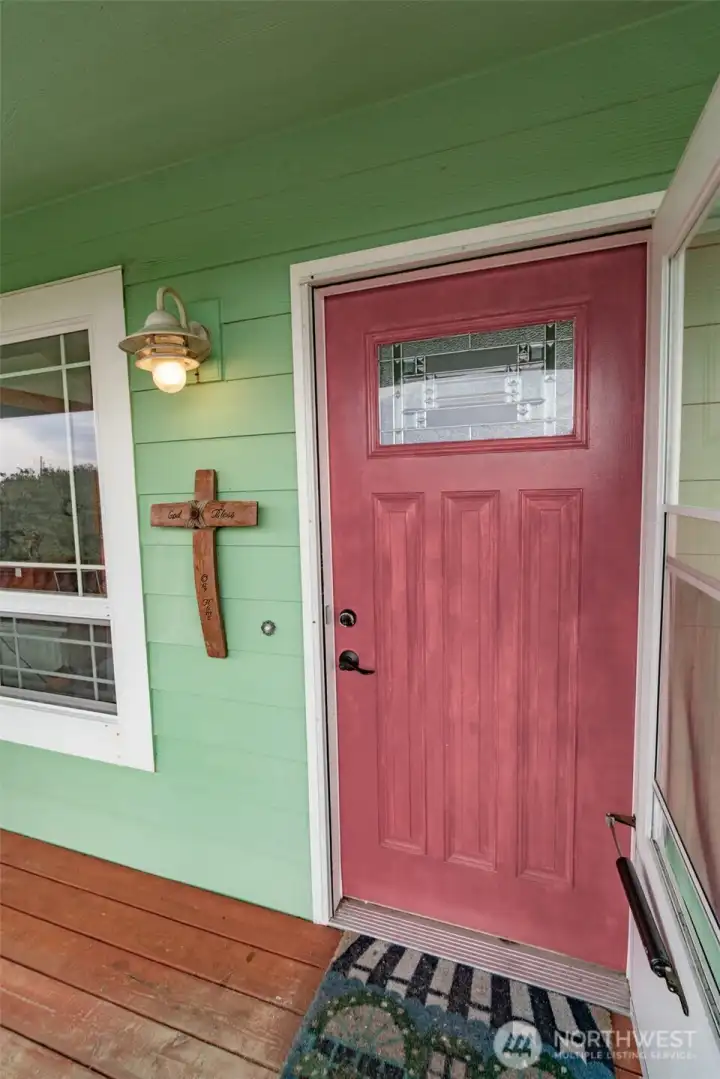 Front door with a decorative glass pane