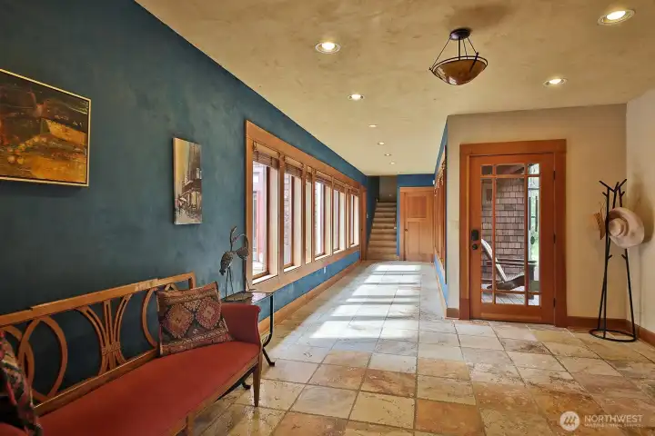 Heading back through the foyer to the primary bedroom