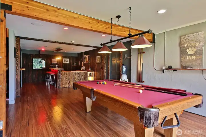 Downstairs - pool table, dry bar, big screen TV, exercise room and storage