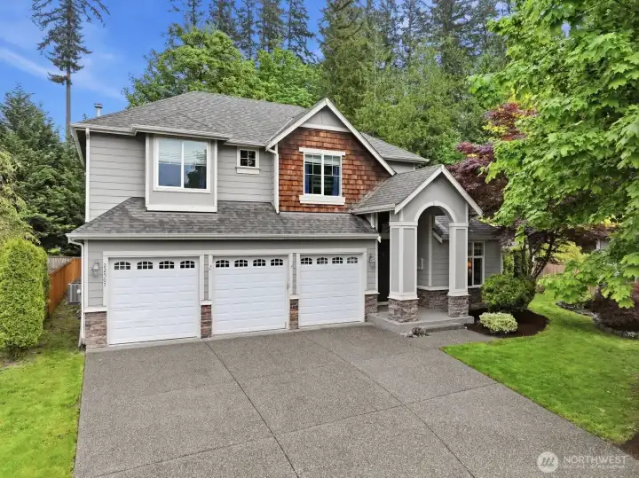 3 car garage with additional driveway parking
