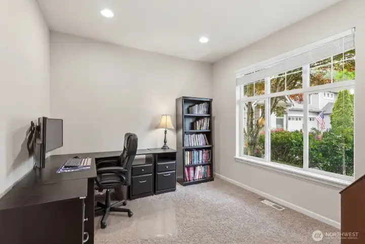 Main floor office with double doors and lots of natural light