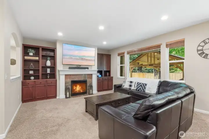 Living room with gas fireplace and built-in cabinets