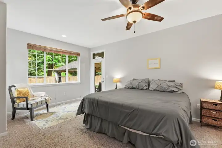 Main floor primary bedroom with access to the covered patio