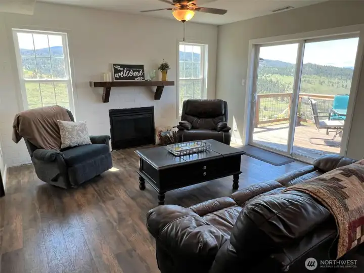 Enjoy views from the living room with slider onto the back deck. Enjoy views from the living room with slider onto the back deck.