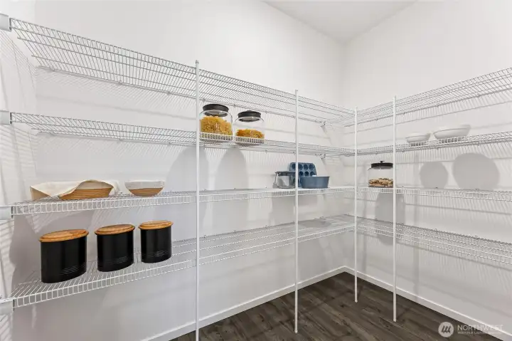 Huge walk-in pantry off the kitchen. Actual home is under construction and colors, materials, and finishes may vary. See site agent for details. Huge walk-in pantry off the kitchen. Actual home is under construction and colors, materials, and finishes may vary. See site agent for details.