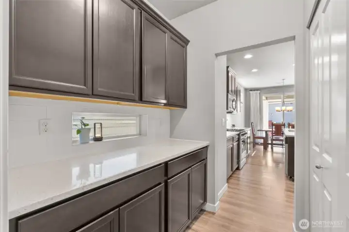 The Butler's Pantry offers plenty of additional storage space, & makes for an incredible coffee bar or hidden space for table top appliances.