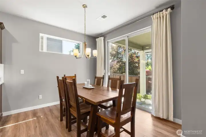 Enjoy dinner at the table with views of the beautiful back yard.