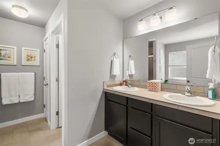 Doubly vanity, and plenty of space make this bathroom a dream.