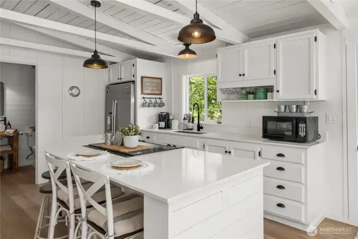 Spacious show stopper kitchen with eating bar.  Fully remodeled and cute as a button. Every detail thought out to make good use of the space.