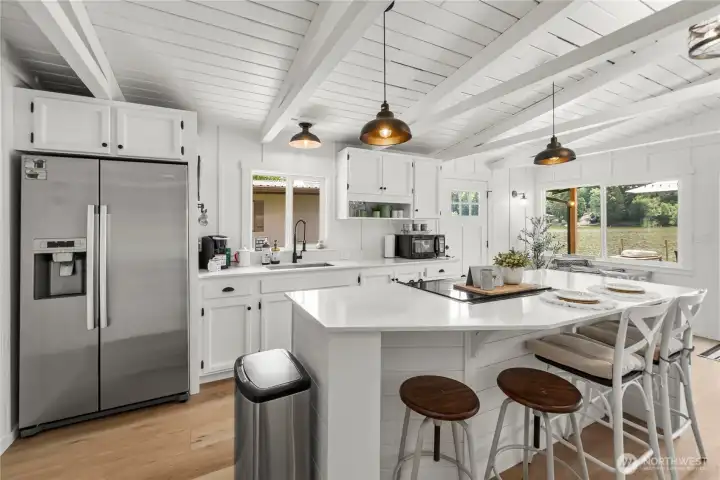 Kitchen is open and spacious with amazing views of the lake.