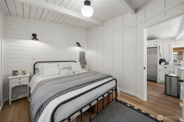 Large cozy bedroom with vaulted ceilings.