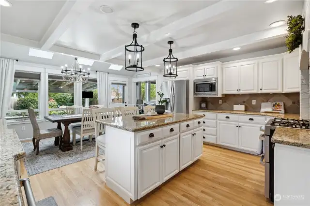 Chef's kitchen with solid wood cabinets, stainless appliances and lots of counter space.