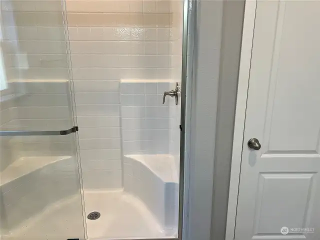 Walk in shower and linen closet.