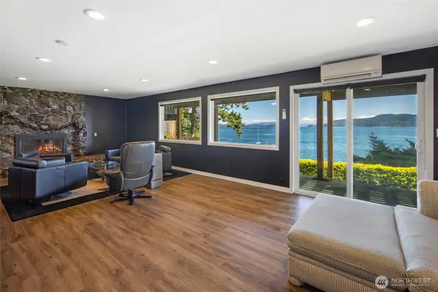 Lower level great room with views sitting area, murphy bed and access to a covered patio.